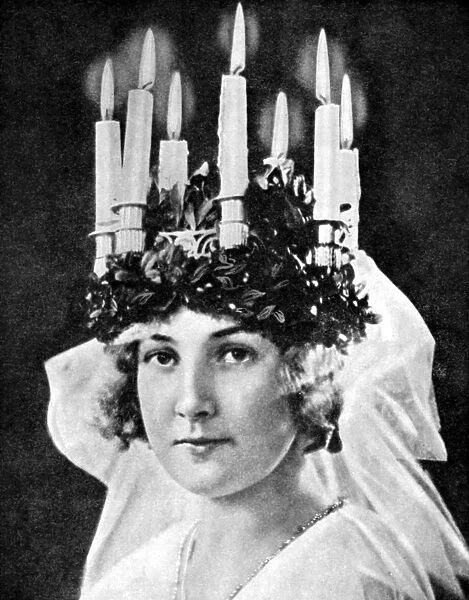 Scandinavian girl wearing candle headdress on St Lucys Day, 1936. Artist: Fox