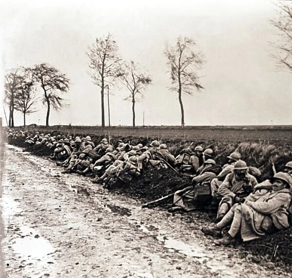 Troops resting by the side of a road, northern France, c1914-c1918