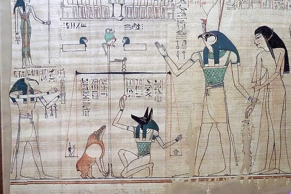Weighing of the heart of the deceased against the feather of truth from the Egyptian Book of the Dea