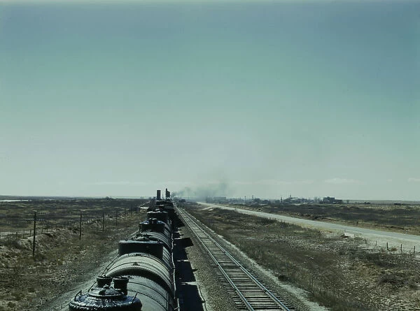 West bound Santa Fe R. R. freight train stopping for water, Tolar, New Mexico, 1943. Creator: Jack Delano