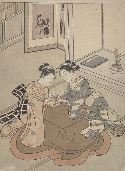 Two Young Women Seated by a Kotatsu Playing Cats Cradle, ca. 1765. ca. 1765