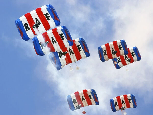 Parachutists from the Royal Air Forces Falcons Display Team, drift gently back