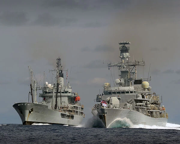 Picture are, on the left RFA GOLD ROVER, and on her right HMS LANCASTER sailing together