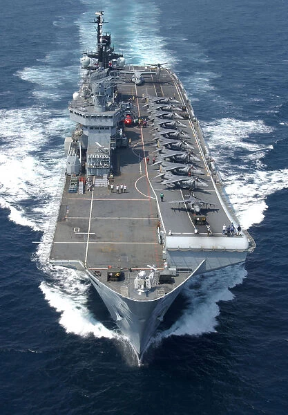 USMC Harriers line the deck of HMS Illustrious