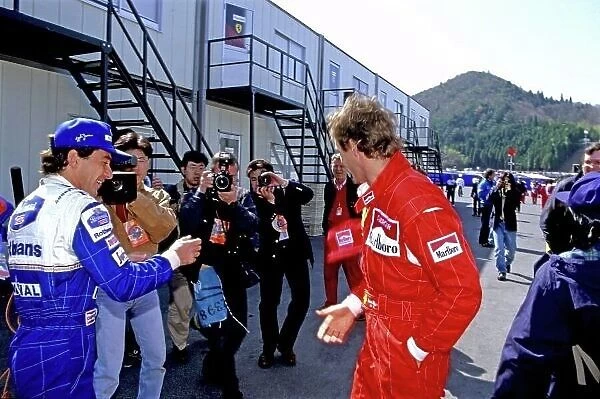 1994 Pacific Grand Prix. Tanaka International, Aida, Japan. 15-17 April 1994. Ayrton Senna (Williams Renault) jokes with former team mate Gerhard Berger (Ferrari 412T1), in the paddock, portrait. Ref-94 PAC 62 World Copyright - LAT Photographic
