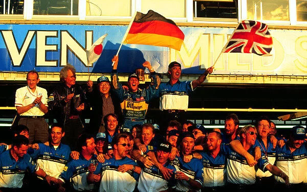 1995 PACIFIC GP. Michael Schumache celebrates with Flavio Briatore