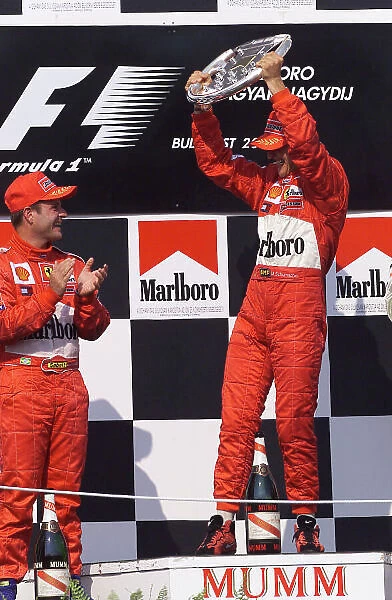 2001 Hungarian Grand Prix Hungaroring, Hungary. 19th August 2001. Michael Schumacher, Ferrari F2001, takes his 4th Formula 1 World Championship, the constructors tiltle for Ferrari and equals Alain Prosts 51 carrer wins. World Copyright