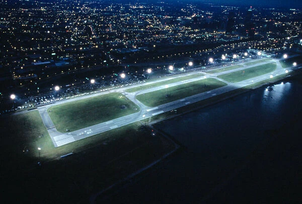 2003 Champ Car World Series. Burke Lakefront Airport, Cleveland, Ohio. 3rd - 5th July 2003. Aerial view of the floodlit Burke Lakefront Airport Circuit with Clevelands night time lights. Photo: LAT Photographic ref: 35mm Transparency