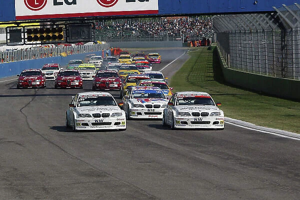 2004 European Touring Car Championship Imola, Italy. 4th - 5th September 2004 Jan Magnussen (Peugeot Sport Peugeot 307 Gti) leads dm and Andy Priaulx (BMW Team Great Britain BMW 320i) at the start of the race