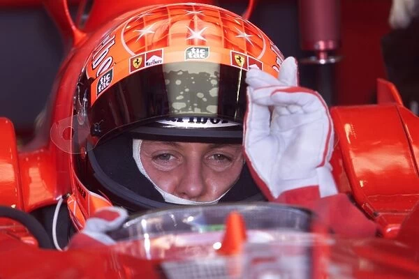 Australian GP: Michael Schumacher Ferrari F1 2001 signals for his engine to be started for the first timed practice of 2001