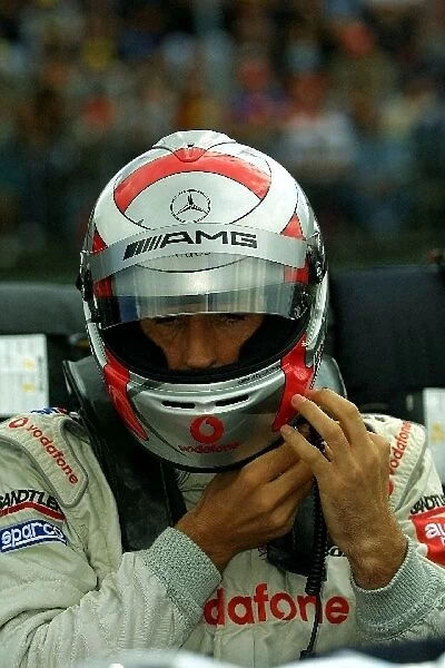 DTM Championship: Bernd Schneider Vodafone AMG Mercedes fastens his HANS device to his helmet