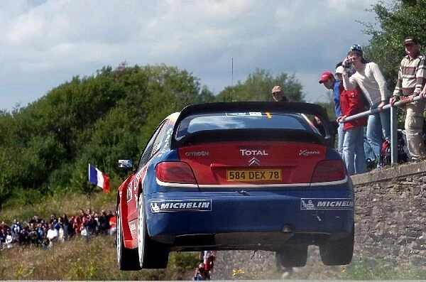 FIA World Rally Championship: Leg one rally leader Sebastien Loeb, Citroen Xsara WRC, flies over a jump on Stage 4