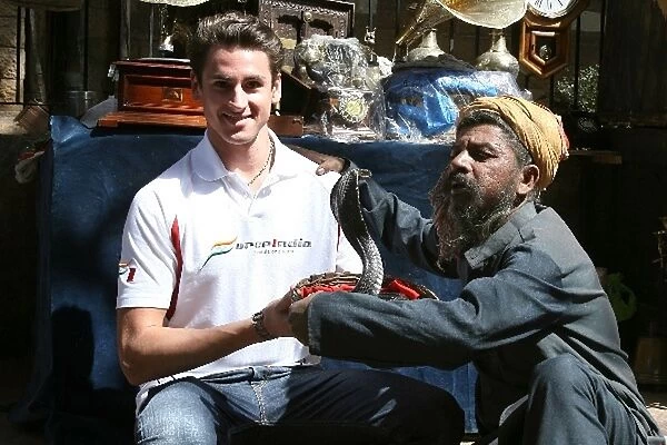 Force India F1 Drivers in Mumbai: Adrian Sutil, Force India F1 Team, with a snake charmer and King Cobra