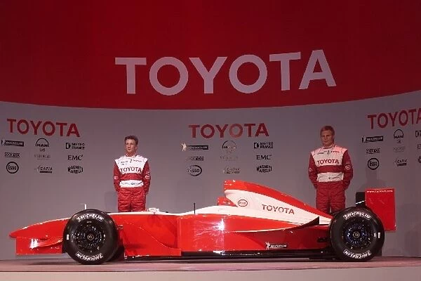 Formula One Launch: Allan McNish talks with Mika Salo, stand with the Toyota F1 car