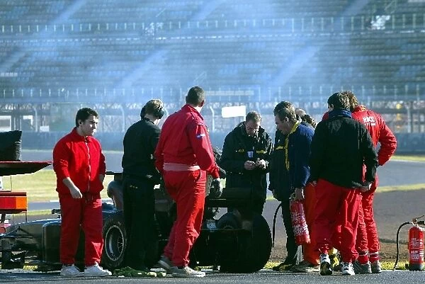 Formula One Testing: The Jordan Ford EJ13 of Giancarlo Fisichella needs to be recovered by the recovery truck after suffering a mechnical failure