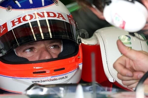 Formula One Testing: Rubens Barrichello Honda Racing F1 Team talks with an engineer