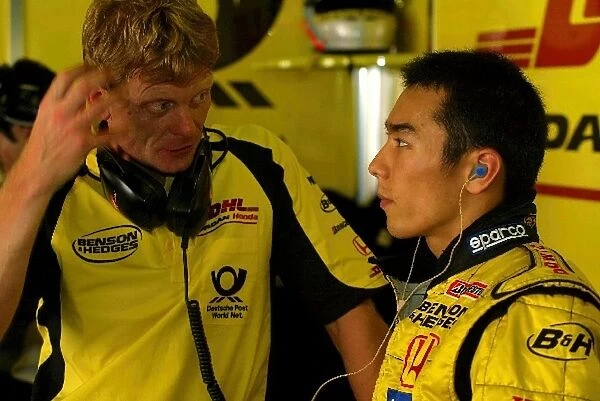 Formula One Testing: Takuma Sato Jordan Honda, right, talks with his physio Martin Whittingham
