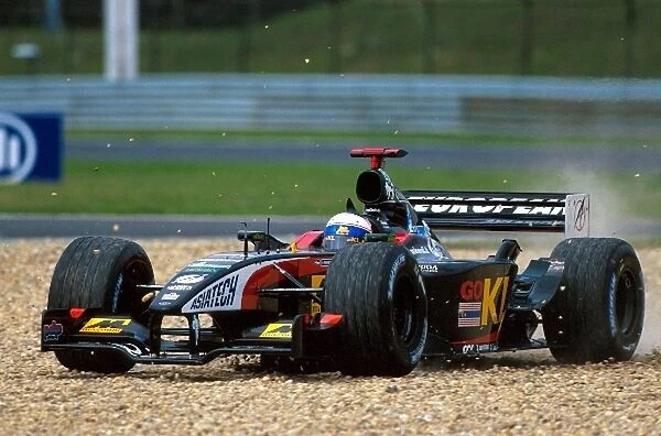 Formula One World Championship: Anthony Davidson Minardi Asiatech PS02 takes to the gravel during his debut Grand Prix
