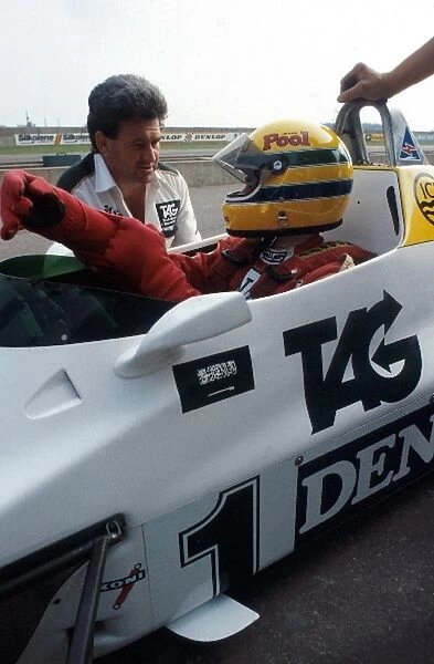 Formula One World Championship: Ayrton Senna receives final instructions by the Williams Team Manager Allan Challis prior to his first run in