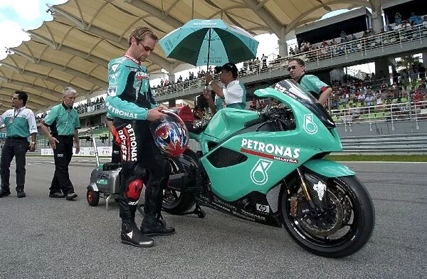 Formula One World Championship: Carl Fogarty Foggy Team Petronas Team Owner demonstrates the FP1 that his new Superbike team are using