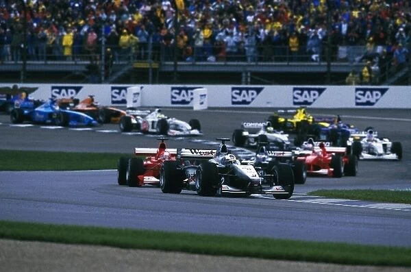 Formula One World Championship: David Coulthard Mclaren MP4-15 leads Michael Schumacher Ferrari F1 2000 having been ajudged to have jumped the start