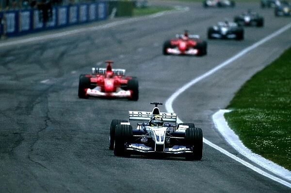 Formula One World Championship: Fourth placed Ralf Schumacher Williams BMW FW25 battles for the lead with brother Michael Schumacher Ferrari F2002