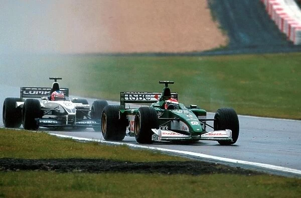 Formula One World Championship: Johnny Herbert Jaguar Cosworth R1, DNF, leads Jenson Button