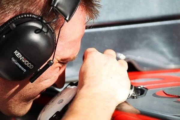 Formula One World Championship: McLaren MP4  /  25 GPS unit is fitted by an engineer