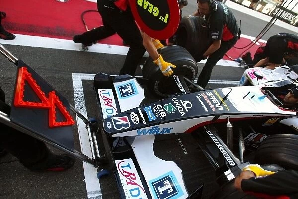 Formula One World Championship: Minardi practice pitstops with a new front jack that has flashing lights to aid the drivers to the correct spot