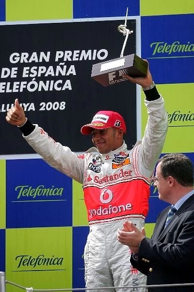 Formula One World Championship: Third place Lewis Hamilton Mclaren on the podium with the trophy