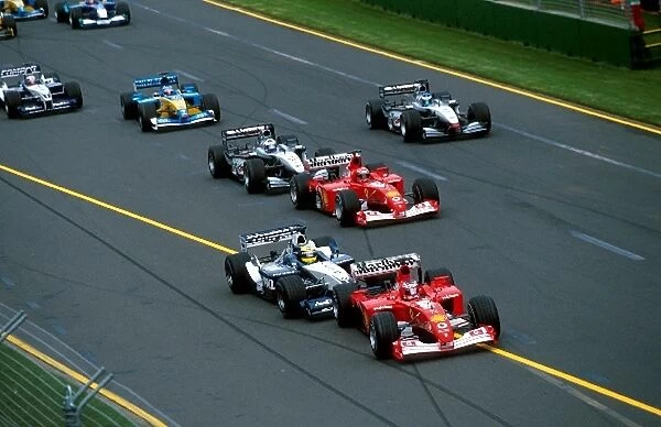 Formula One World Championship: Pole sitter Rubens Barrichello Ferrari F2001 is hit from behind by the hard charging Ralf Schumacher Williams