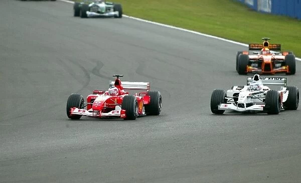 Formula One World Championship: Second placed Rubens Barrichello Ferrari F2002 overtakes Olivier Panis BAR Honda 004 who finished fifth