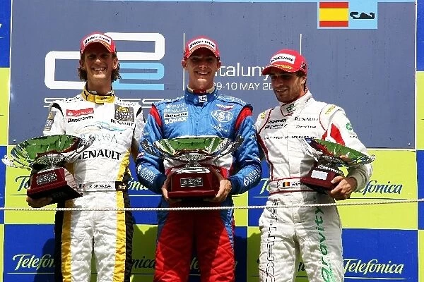 GP2 Series: The podium: Romain Grosjean Renault Third Driver, second; Edoardo Mortara Telmex Arden International, race winner Jerome d Ambrosio DAMS