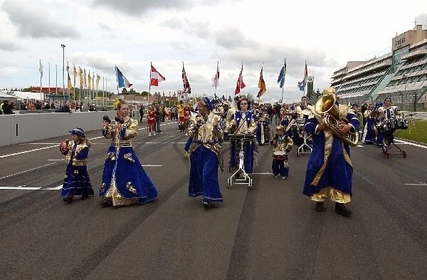 A local band, playing in traditional costume: DTM Championship, Rd3, Nurburgring, Germany. 25 May 2003
