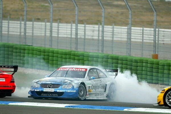 DTM. Thomas Jager (GER) Mercedes CLK DTM spins during the race.