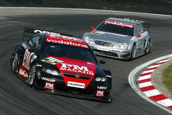 DTM. Timo Scheider (GER), OPC Team Phoenix Opel Astra V8 Coupe, leads Christijan Albers 