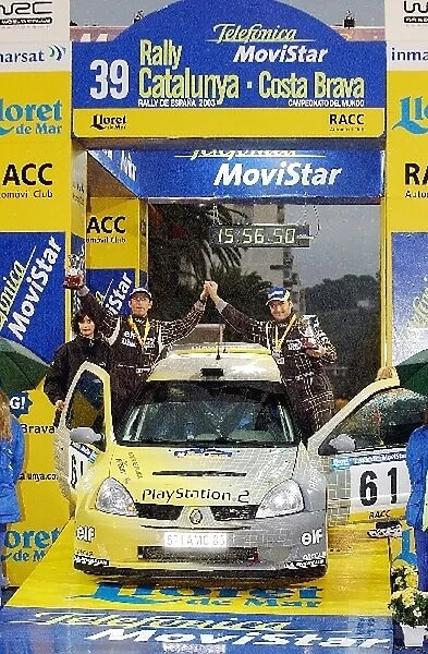 World Rally Championship: Brice Tirabassi with co-driver Jacques-Julien Renucci Renault Clio Super 1600 celebrate victory in the World Junior