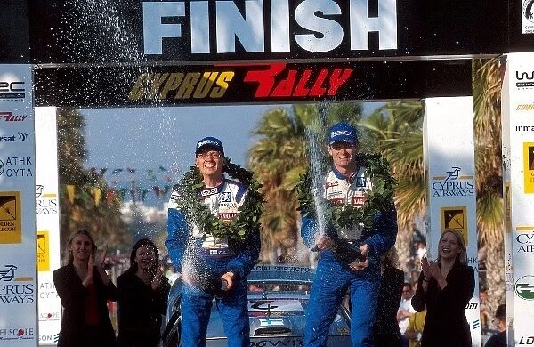 World Rally Championship: L-R: Timo Rautiainen  /  Marcus Gronholm Peugeot, winners of the rally