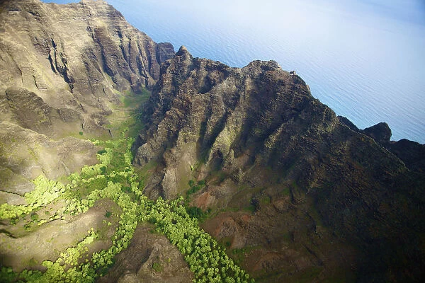 Aerial View Of The Rugged Landscape Along The Coast Of A Hawaiian Island, Na Pali Coast; Kauai, Hawaii, United States Of America