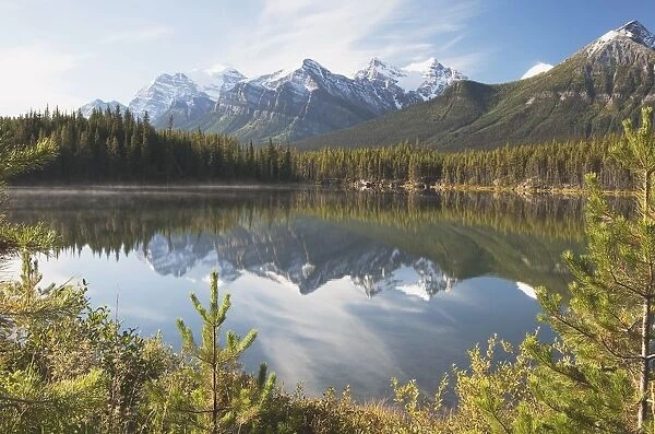 Banff National Park, Alberta, Canada; Mountains Reflected In A Lake In Late Summer