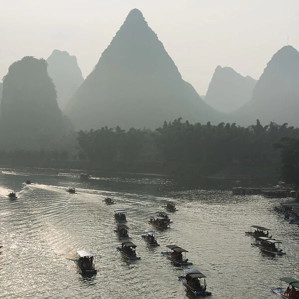 Boats Along The Li River At Sunset; Guilin, Guangxi, China