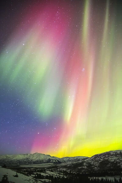 A Colourful Aurora Display Over Granite Mountain, South Of Delta Junction; Alaska, United States Of America