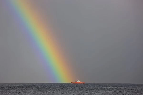 Dunoon, Argyll, Scotland; Rainbow Leading To A Boat On The Ocean