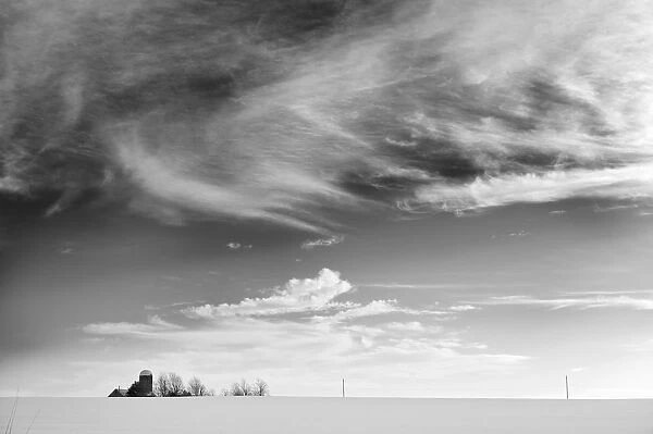 Farm In The Distance In A Snowy Field, Maricourt, Quebec, Canada