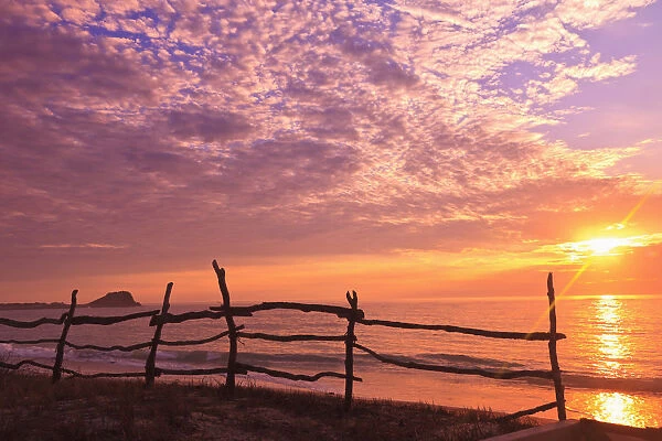 A Fence Along The Waters Edge At Sunrise At Cabo Pulmo; Baja California Sur, Mexico
