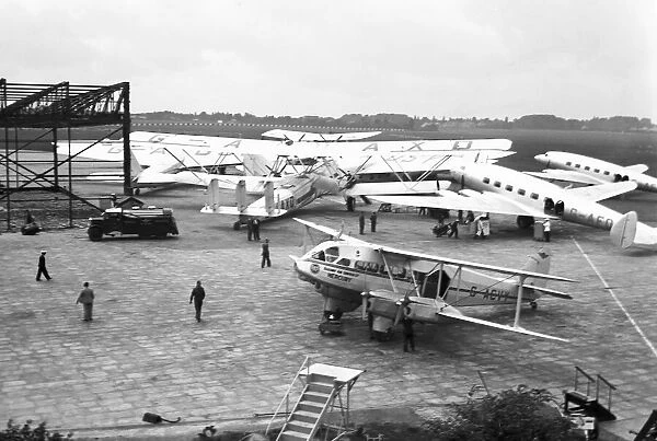 in the foreground DE HAVILLAND DH. 86 EXPRESS, G-ACVY  /  2302, RAILWAY AIR SERVICES at Castle Bromwich Aerodrome