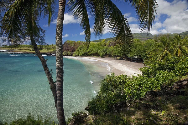 Hawaii, Maui, Hana, A sunny view of Hamoa Beach with clear ocean on a calm day