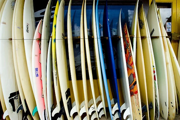 Hawaii, Oahu, North Shore, Haleiwa, row of surfboards outside of a surfshop