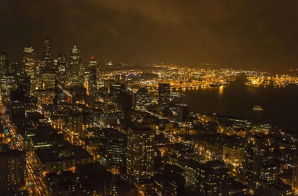 The Lights Of Seattle Are Viewed From The Space Needle At Night; Seattle, Washington, United States Of America