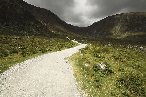 Lone Person Walking On A Path Leading Up To Mahon Falls In The Comeragh Mountains In Munster Region; County Waterford, Ireland